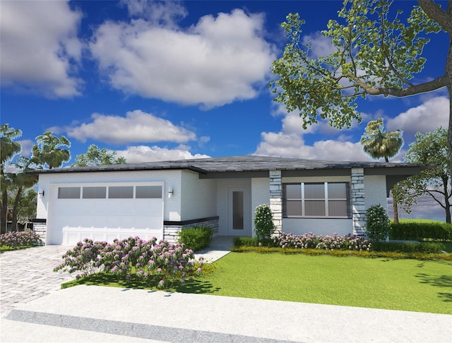 view of front of property with a garage and a front lawn