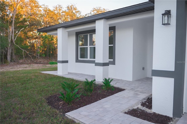 view of property exterior with a yard