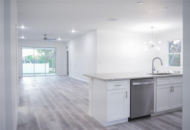 kitchen featuring white cabinetry, dishwasher, sink, light hardwood / wood-style floors, and pendant lighting