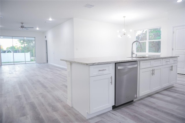 kitchen with dishwasher, white cabinets, a healthy amount of sunlight, and sink