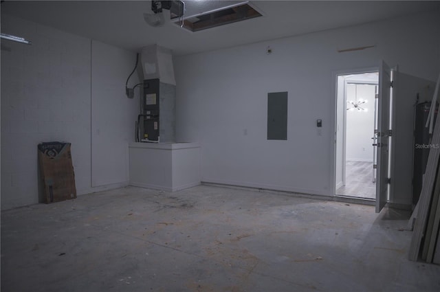 garage with electric panel and heating unit