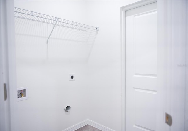 laundry area featuring washer hookup, hardwood / wood-style flooring, and electric dryer hookup