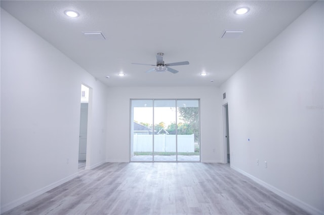 unfurnished room with ceiling fan and light hardwood / wood-style flooring