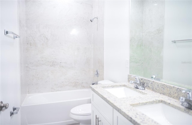 full bathroom with vanity, toilet, and tiled shower / bath combo