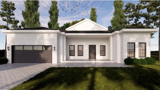 372 Matson Ln, Port Charlotte, FL 33953 - view of front of home featuring an attached garage, decorative driveway, and a front yard