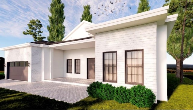 372 Matson Ln, Port Charlotte, FL 33953 - modern home with an attached garage, stucco siding, and driveway