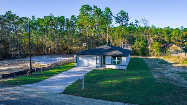 view of front facade featuring a front lawn and a garage