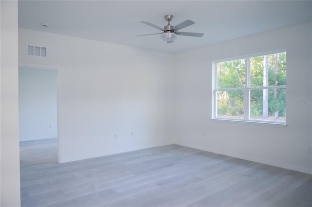 unfurnished room featuring ceiling fan and light hardwood / wood-style floors