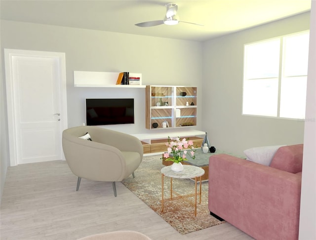 living room featuring a healthy amount of sunlight, ceiling fan, and light hardwood / wood-style floors