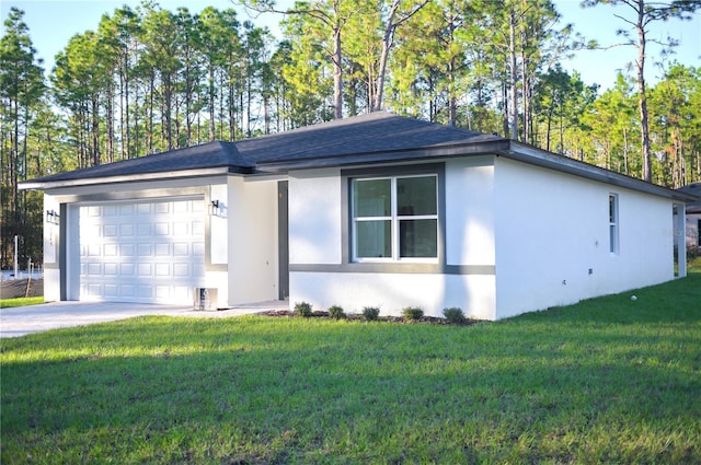 ranch-style house with a garage and a front lawn