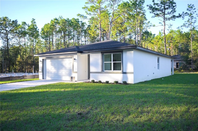 view of front of property featuring a garage and a front lawn