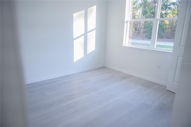 unfurnished room featuring light hardwood / wood-style flooring