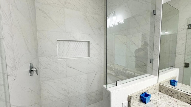 bathroom with a shower with shower door