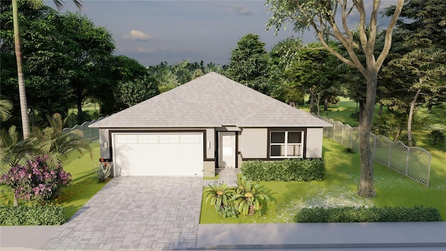 view of front of property with a garage and a front yard