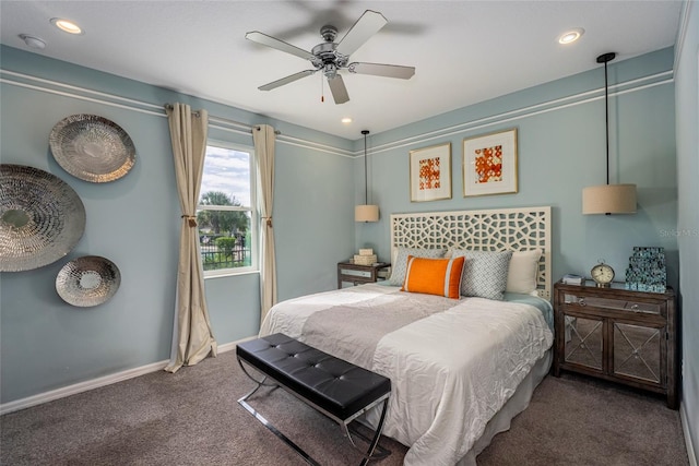 bedroom with ceiling fan and dark carpet