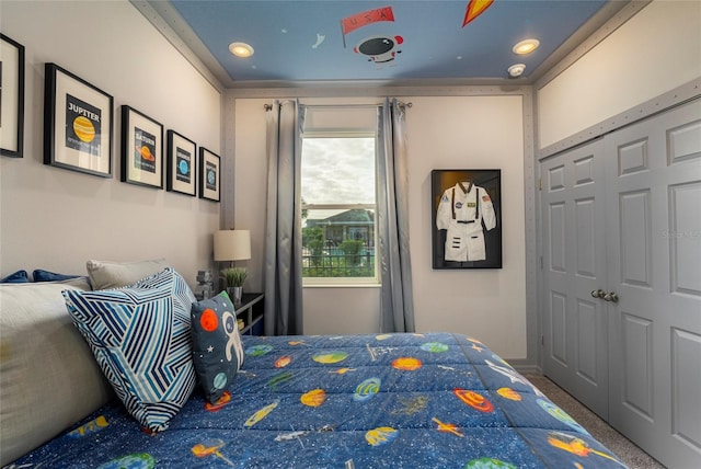 carpeted bedroom featuring a closet