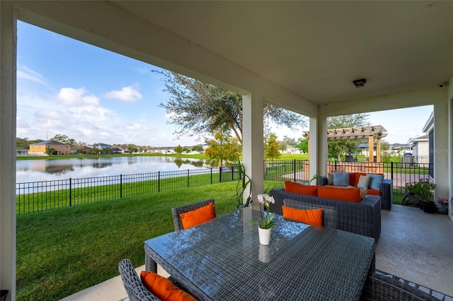 view of patio featuring a pergola and a water view