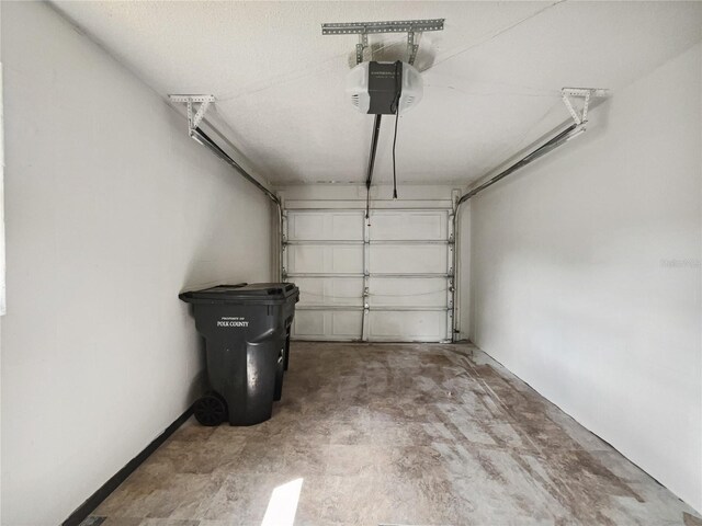 garage featuring a garage door opener