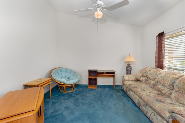 living room with ceiling fan and dark colored carpet