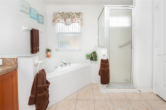 bathroom with vanity, tile patterned floors, and separate shower and tub