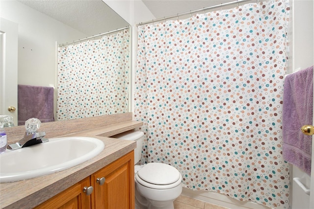 bathroom with tile patterned flooring, a shower with shower curtain, a textured ceiling, vanity, and toilet