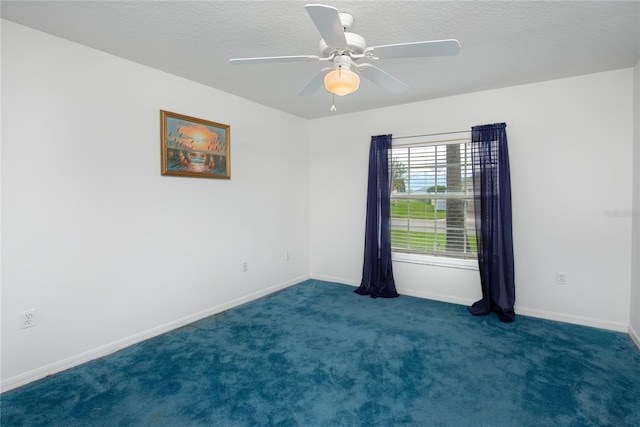 carpeted empty room with a textured ceiling and ceiling fan