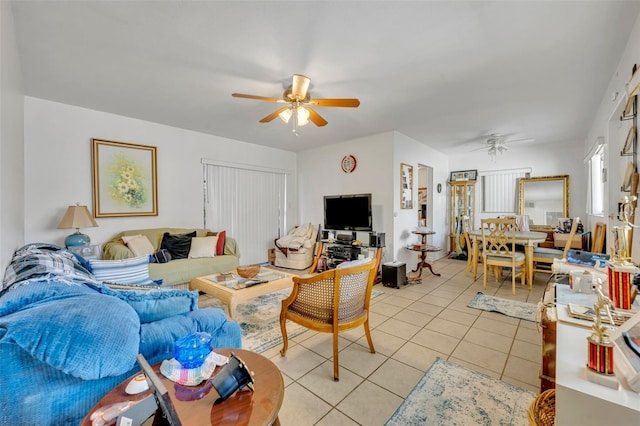 living room featuring light tile patterned floors and ceiling fan