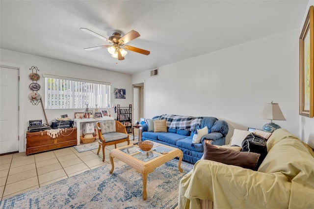 living room with ceiling fan and light tile patterned flooring