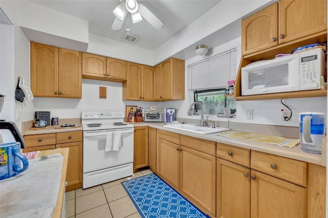 kitchen with white appliances, ceiling fan, sink, and light tile patterned flooring