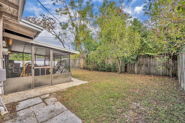 view of yard with a sunroom