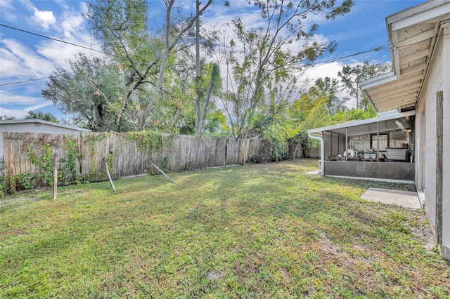 view of yard with a sunroom