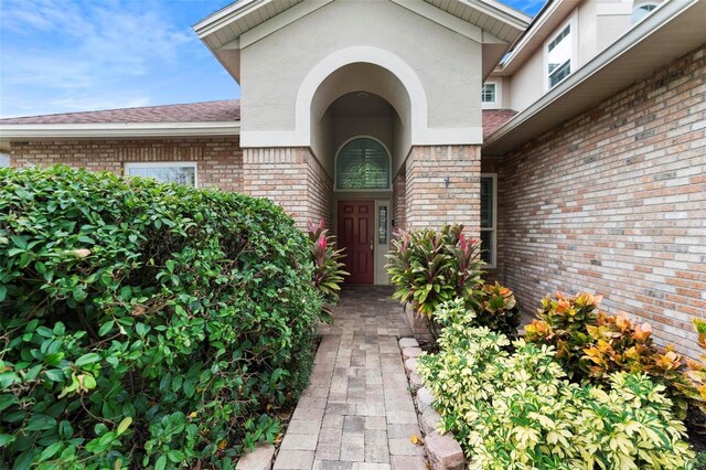 2626 Raccoon Run Ln, Orlando, FL 32837 - property entrance with brick siding and stucco siding