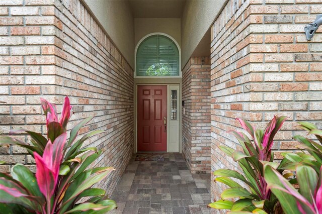 2626 Raccoon Run Ln, Orlando, FL 32837 - doorway to property featuring brick siding