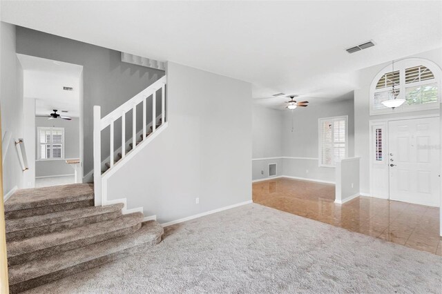 2626 Raccoon Run Ln, Orlando, FL 32837 - entrance foyer featuring stairs, a ceiling fan, and baseboards