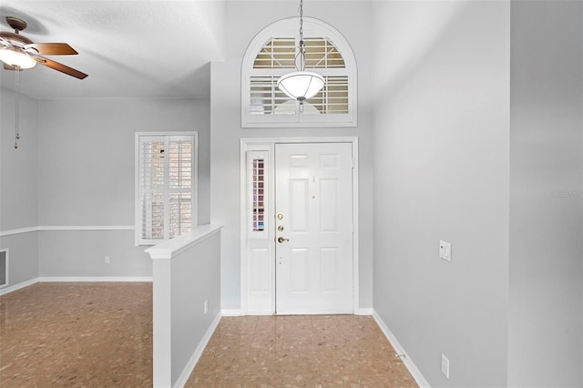 2626 Raccoon Run Ln, Orlando, FL 32837 - foyer featuring a ceiling fan and baseboards