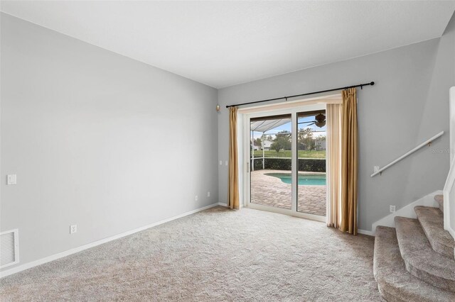 2626 Raccoon Run Ln, Orlando, FL 32837 - carpeted spare room with baseboards and stairway