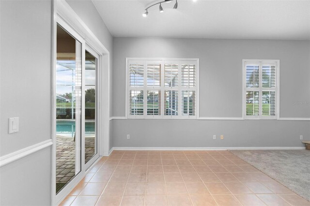2626 Raccoon Run Ln, Orlando, FL 32837 - spare room featuring plenty of natural light and light tile patterned floors