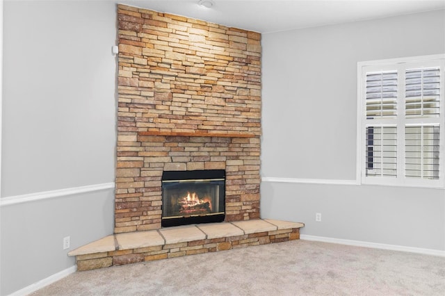 2626 Raccoon Run Ln, Orlando, FL 32837 - unfurnished living room with a fireplace, carpet flooring, and baseboards