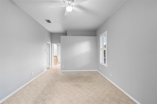 2626 Raccoon Run Ln, Orlando, FL 32837 - carpeted spare room with a ceiling fan, baseboards, attic access, and a textured ceiling