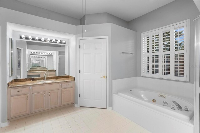 2626 Raccoon Run Ln, Orlando, FL 32837 - full bathroom with a whirlpool tub, tile patterned floors, and vanity