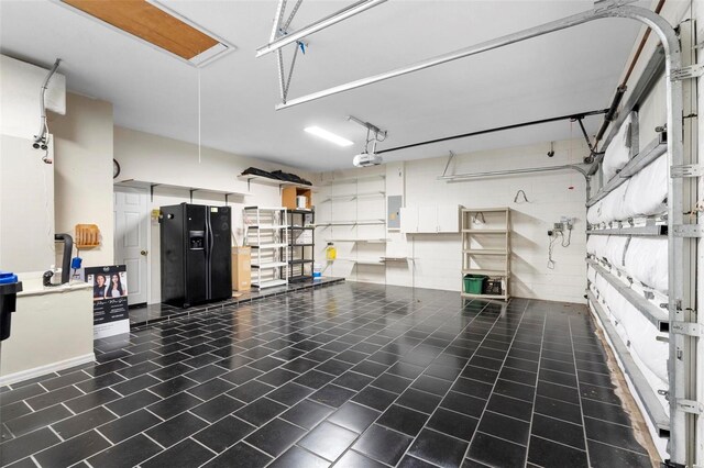 2626 Raccoon Run Ln, Orlando, FL 32837 - garage with electric panel and a garage door opener