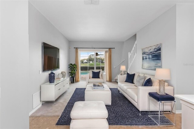2626 Raccoon Run Ln, Orlando, FL 32837 - living room with baseboards and stairway