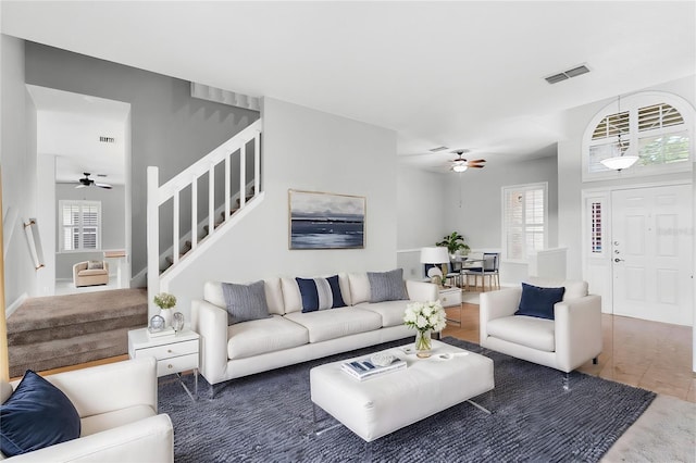 2626 Raccoon Run Ln, Orlando, FL 32837 - living room featuring ceiling fan, stairway, and wood finished floors