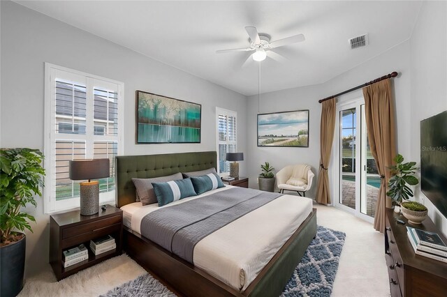 2626 Raccoon Run Ln, Orlando, FL 32837 - bedroom with access to exterior, light carpet, and ceiling fan