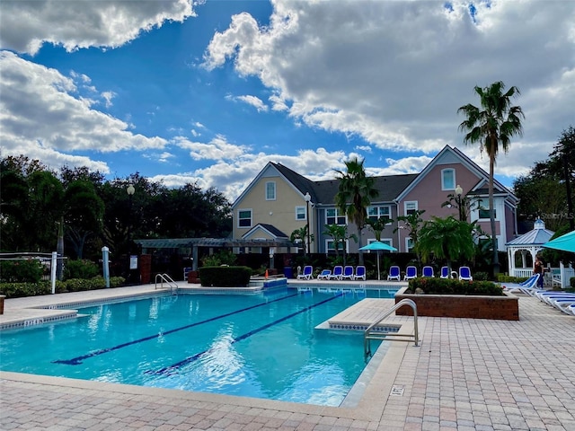 3468 Soho St Unit 107, Orlando, FL 32835 - community pool with a patio