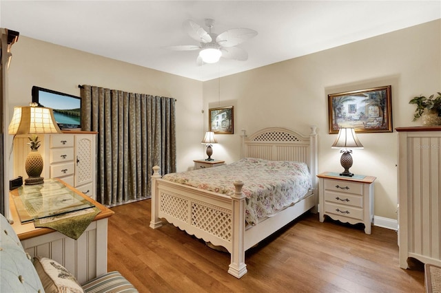 bedroom with hardwood / wood-style flooring and ceiling fan