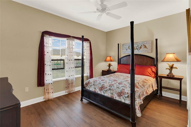 bedroom with dark wood-type flooring and ceiling fan