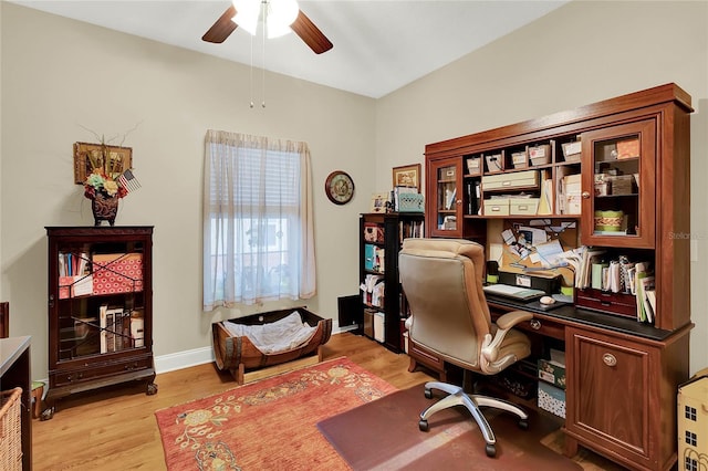 office with ceiling fan and light wood-type flooring