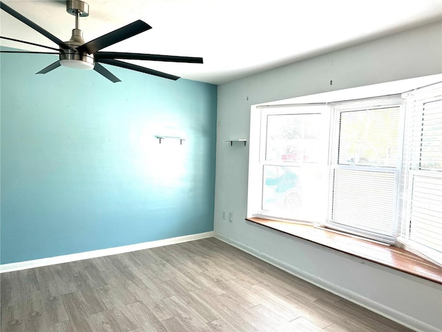 empty room featuring light hardwood / wood-style floors and ceiling fan