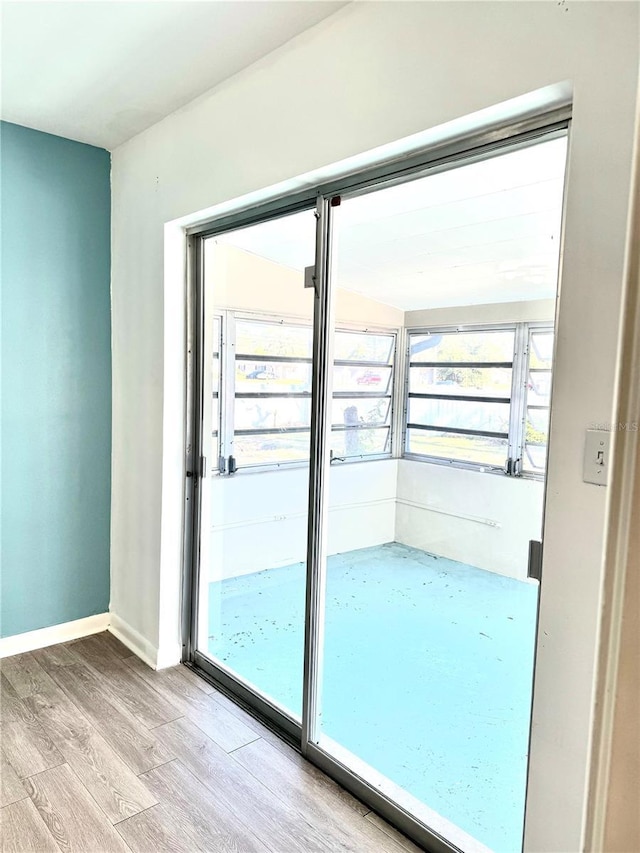 doorway with light hardwood / wood-style floors